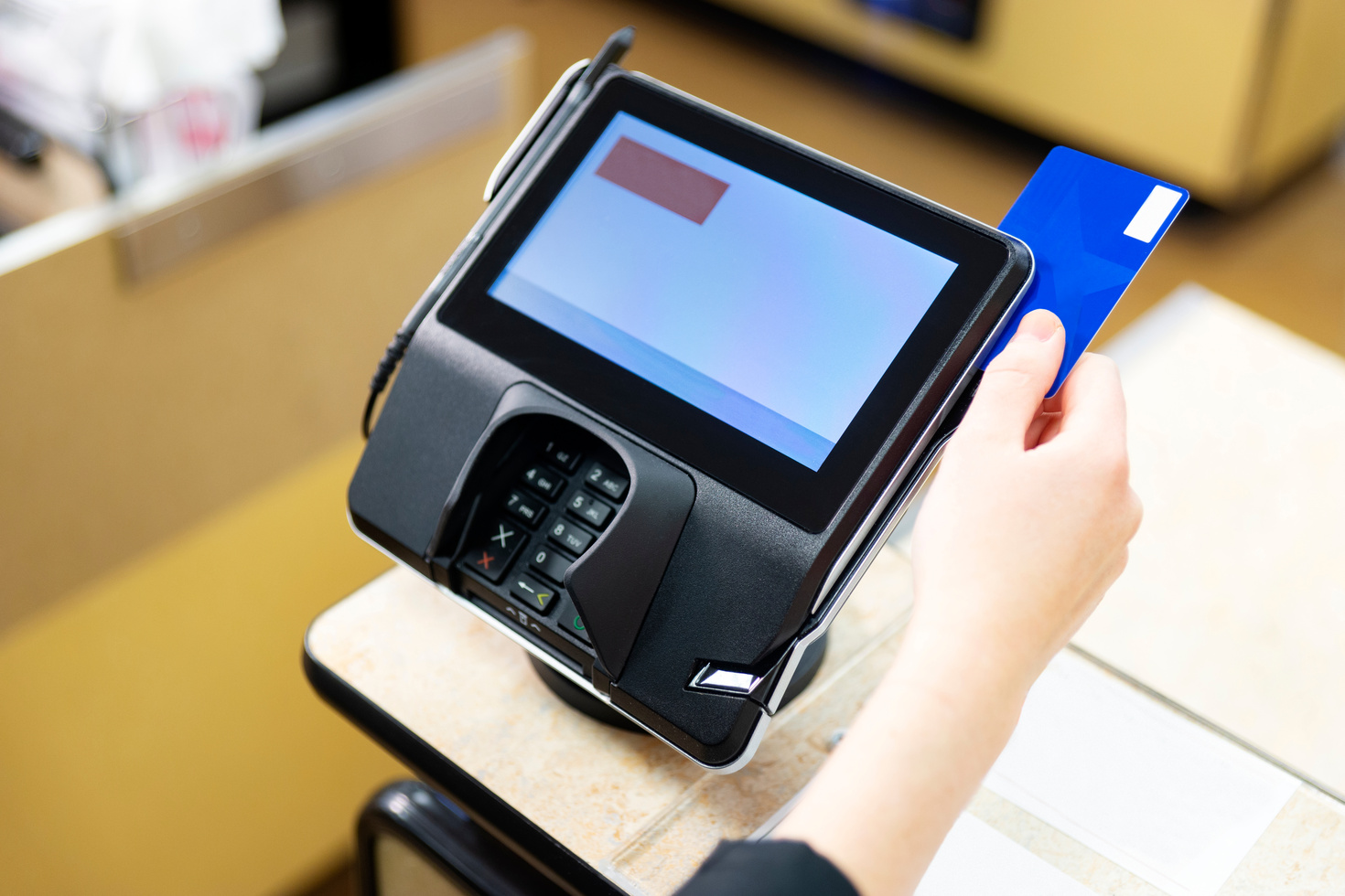 A retail point of sale credit and debit card scanner.